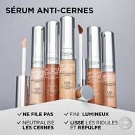 Trois bras de carnations differentes (peau claire, mate et foncee) sur lesquels sont appliquees plusieurs nuances du serum anti-cernes. Le texte « 18 Teintes » confirme la diversite de la gamme pour toutes les carnations.