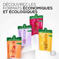 Plusieurs recharges ecologiques de shampoing L’Oreal Paris sont presentees cote a cote. Les recharges souples sont de couleurs differentes selon la gamme de shampoings : orange pour Dream Long, violet clair pour Hyaluron Repulp, rouge pour Color Vive et dore pour Huile Extraordinaire. Chaque recharge porte la mention « Recyclable refill – 60 % less plastic » en anglais et en francais.