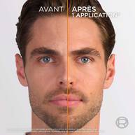 Image divisee verticalement montrant le visage d'un homme. La partie gauche est 'AVANT' (teint terne) et la partie droite est 'APRES 1 APPLICATION' (teint plus lumineux et uniforme), avec une ligne orange separant les deux.