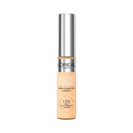 Photo du tube Accord Parfait Serum Anti-Cernes sur fond blanc. Le flacon transparent laisse voir la texture beige et possede un bouchon argente brillant. L'etiquette precise la formule enrichie a 1,5 % d'acide hyaluronique et de cafeine.